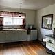 Kitchen with wood cookstove, propane cooktop and kitchen sink