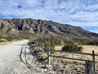 Gravel road leading into the Frijole Ranch area.  Views of the Guadalupe Mountains in the background.