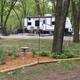 Large seasonal RV site with trailer and landscaped area — demonstrates a typical RV/seasonal pitch and site layout on the property.