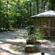 Screened pavilion/shelter within the campground with surrounding grounds visible — demonstrates a common guest facility and site character. Source: About Us gallery images.