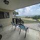 Condo porch overlooking the lake and park grounds — demonstrates condo accommodations and lake view on the property (condo photo on main site).