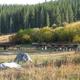 Day Use - Group Site 20, site surrounded by pine trees, picnic tables & fire ring & benchesDay Use - Group Site 20