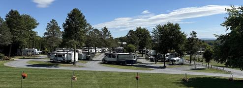 Panoramic overlook of the RV loops and sites with rigs parked — useful ground-level view of site arrangement and spacing (from site slideshow/overlook image).