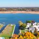 Aerial view showing the campground layout, docks and lakeshore (supports property location on Lake Pleasant; from homepage/social image).