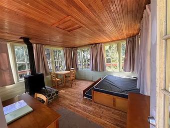 Timber Butte Cabin stove, desk, and bed.