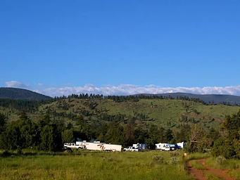 Trucks and trailers in a group location.