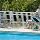 Outdoor swimming pool with lounge chairs and a person jumping/diving — shows a key on-site amenity (homepage slide depicting park facilities).