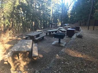 A view of the picnic tables, bear boxes, and other facilities.