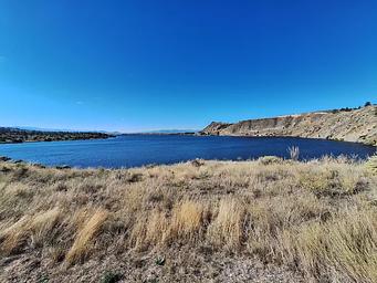 View from walking path toward Elkhorn Mountains and Hauser Lake