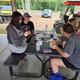 Covered picnic pavilion with picnic tables and nearby utility vehicles — shows social/gathering facility and site infrastructure for guests (Gallery page).