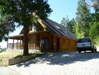 Exterior of the Hillside Cabin showing deck and parking area
