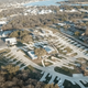 Aerial overview of the entire resort showing site layout, road network, central amenities and nearby lake — clearly from the property (used as a video/thumbnail on the site’s home page). Good for an overall property gallery image.