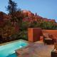 private pool with fireplace at dusk