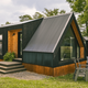 Modern black-clad cabin with A-frame window and outdoor seating on gravel — demonstrates another style of on‑property lodging and grounds context from the resort gallery.