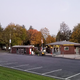View of the office/entrance area and parking from a small hill — useful for showing park entrance and amenities (image found on the site's About page).
