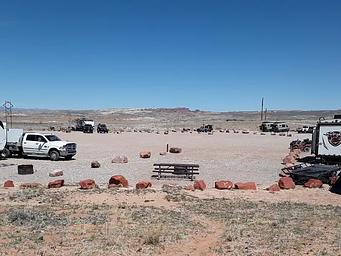 Courthouse Rock Campground campsites with Arches National Park in the distance