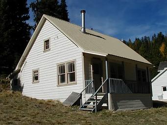 White house with clapboard siding.