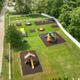 Aerial view focused on the fenced playground area within the campground — highlights family facilities and on‑site recreation spaces.