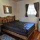 Double bed with nightstands on either side. 