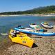 Paddle boards and a kayak along the shores of the Pend Oreille River at Pioneer Park Campground