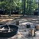Fire circle surrounded by cabins.
