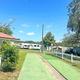 Shuffleboard courts with RVs and parking visible — highlights recreational amenity and nearby RV sites on the property.