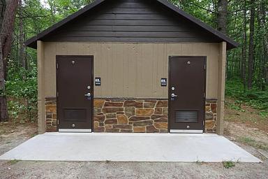 Vault restrooms at Twelve Mile Campground