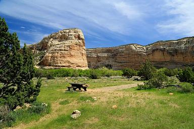 A stunning scene of rock cliffs taken from a campsite at Echo Park Campground