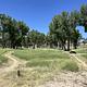 A photo of facility Deerlodge Park Campground showing sandy dirt trails that lead to the walk-in sites