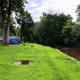 Tent campsites along a creek with grassy sites and picnic table — useful view of primitive/tent camping and creek frontage shown on the campground’s ‘Camping In Lancaster County’ content.