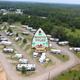 Aerial view of the RV park from the site’s social/open-graph image showing site arrangement and context; useful overview of lots and access roads (homepage social image).