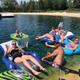Pond/beach scene with guests on inflatable tubes in the water — shows the Haven Pond recreational area and typical water activities available on-site (labeled ‘Haven Pond’ in gallery).