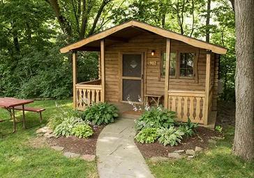 Cozy log cabin site near Lancaster, PA at Country Acres — ideal for couples or solo campers.