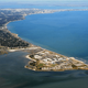 Aerial/coastal overview image of the peninsula and shoreline — useful as an overall location/landscape view for the campground's waterside setting (used on the park's fishing/water activities page).
