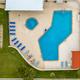 Aerial/top-down view of the resort’s pool and surrounding deck area — good overall overview of on-site pool facility. Source page is the property listing for Leisure World RV Resort.