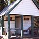 BUCK PARK CABIN - Front of white and green cabin