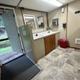 Interior of a restroom/shower facility showing sink and entry — documents on-site amenities (Facilities page).