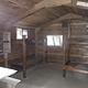 Harding River Cabin wood interior with wood bunkbeds and table