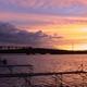 Sunset over lake with docks in foreground — from the site's photo galleries, represents scenic waterfront views available at the campground.