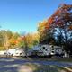 Shows multiple RVs parked on gravel sites with hookups and autumn trees — useful view of the resort’s RV camping area; image is hosted on the resort’s property page.
