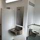 Toilet, sink, and shower all in one large space for convenience in the shower/restroom facility in Brush Creek.