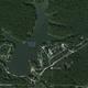 Satellite/aerial view showing the lake and surrounding campground roads and sites — useful overall layout; comes from the About page which describes the property and matches site location.