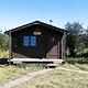 Koknuk Cabin with wood trail in front