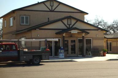 Image of the front office/building facade — shows on-site facility and check-in area, relevant for guest information (Facilities page).