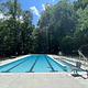 The fenced, outdoor swimming pool at Camp Misty Mount is a big hit during hot summer days