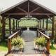Covered outdoor pavilion / communal deck with seating, photographed on the property — good for highlighting onsite gathering spaces and event/retreat facilities referenced on the site.
