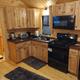 Interior kitchen of a cabin showing fixtures and finishings — good to illustrate cabin interior amenities. Comes from the property’s campsites/cabins gallery (Cabin-3) on the website.
