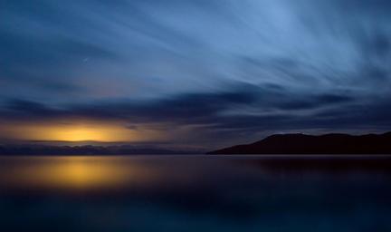 Wide atmospheric lake panorama used on the property home page — an overall scenic view of the lake at dusk that represents the resort’s main water feature and ambience (source: home page).