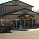 Image of the front office/building facade — shows on-site facility and check-in area, relevant for guest information (Facilities page).