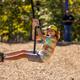 Kids swinging outdoors at Asheboro Jellystone Park